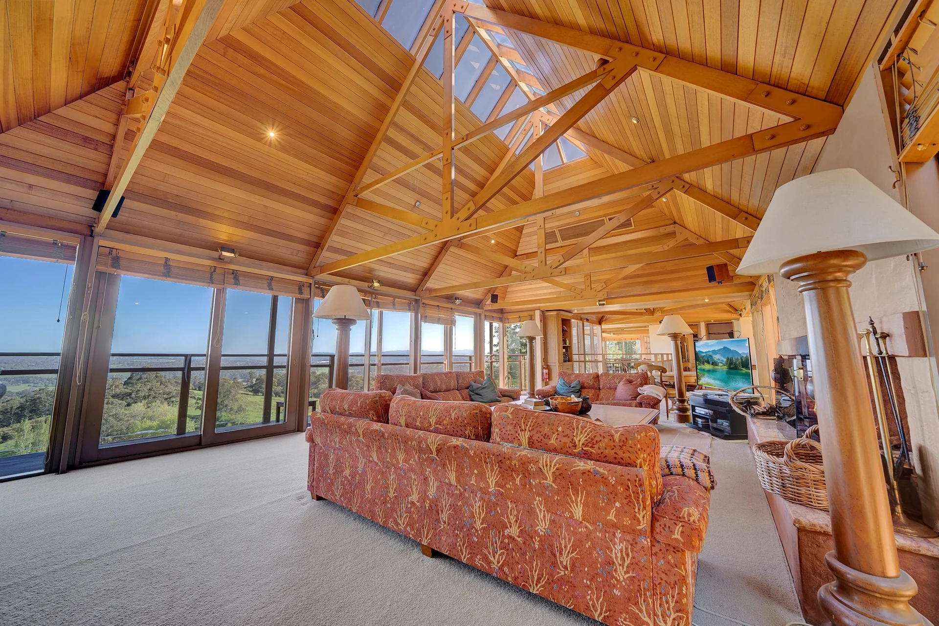 Homestead living room with vaulted timber ceiling and valley outlook